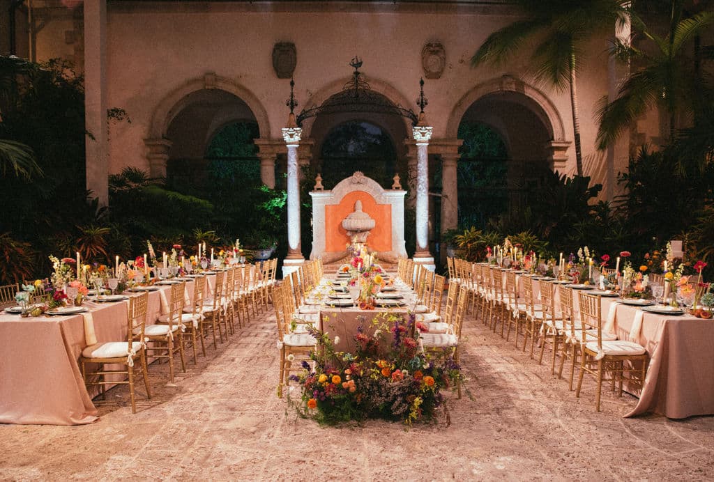 vizcaya wedding courtyard with a Floral Install at the base of the table