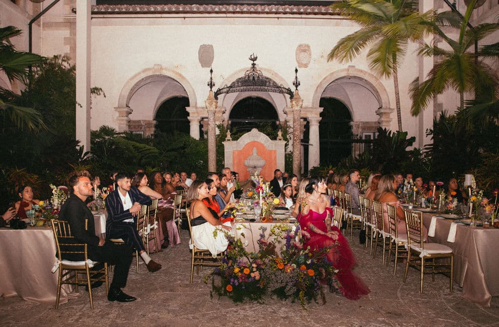 wedding at vizcaya's courtyard with fountain in background.