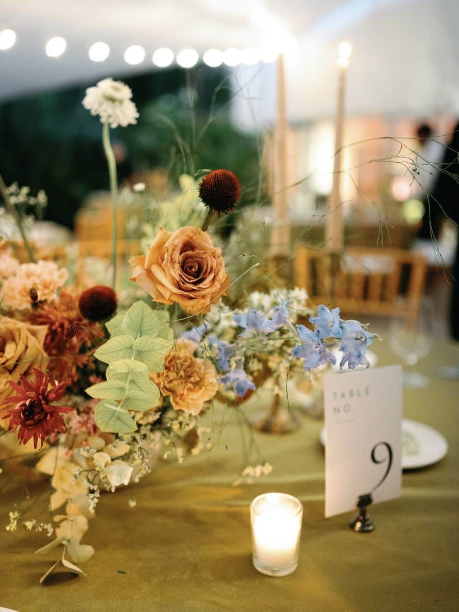 elegant table number 9 display at wedding with toffee roses and nature-inspired floral arrangement in miami, fl