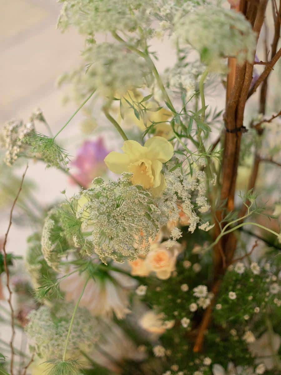 delicate wildflowers and yellow blossoms in wedding decor at coconut grove